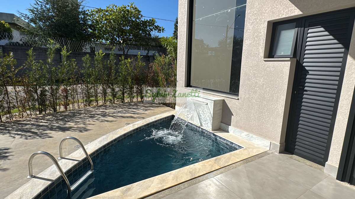 Linda residência térrea de esquina com piscina no Condomínio Jardim dos Lírios em Paulínia-SP - Sylvio Zanetti Corretor de Imóveis